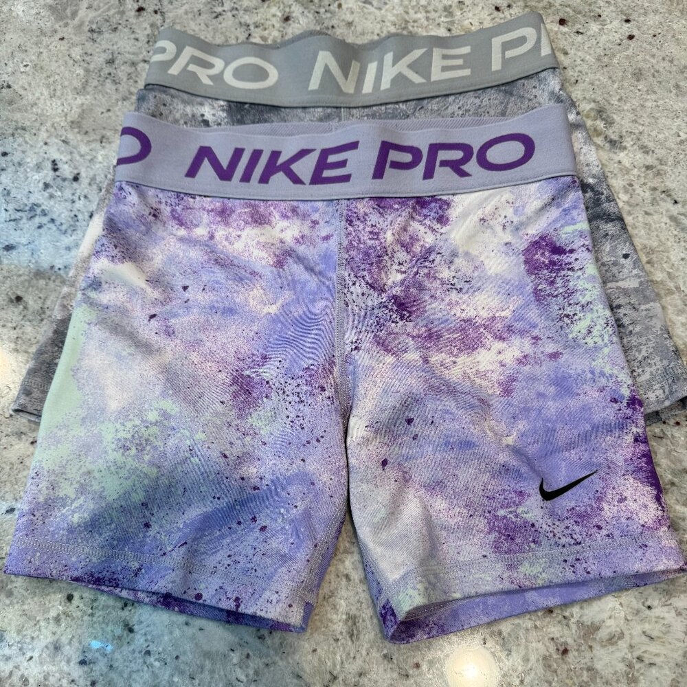 Two pairs of nike pros